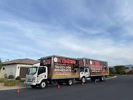On Time Moving Services truck parked on a residential street lined with palm trees